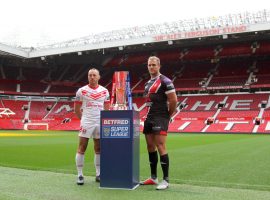 Salford Red Devils captain Lee Mossop poses with the Super League trophy. Credit: Salford Red Devils