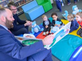 Salford's City Mayor Paul Dennett with kids at a storytime session at Swinton Library (Photo courtesy of Nick Harrison for Salford Leisure)