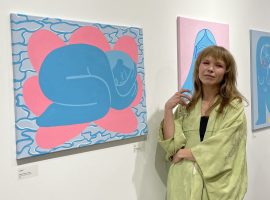 Sophia Dobreva-Nolita with one of her own artworks at the launch of 'Bluebirds' (Image: Rais Esat)