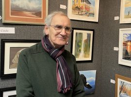 Eric Bromley, of Bolton Art Circle, alongside his art.