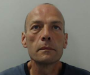 Salford police re-launch appeal to find wanted man