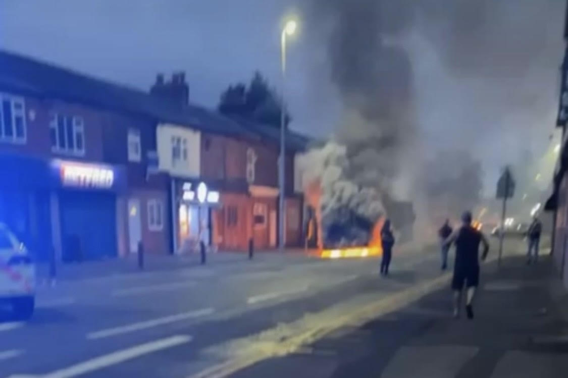 Firefighters rush to the scene as bus bursts into flames in Eccles