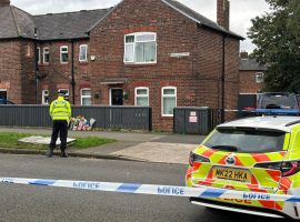 Flowers laid outside house on South Radford Street