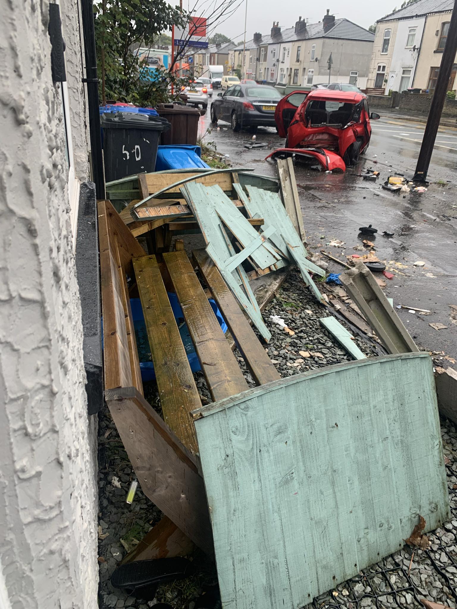 Salford woman's ordeal as car smashes through garden wall narrowly avoiding front room