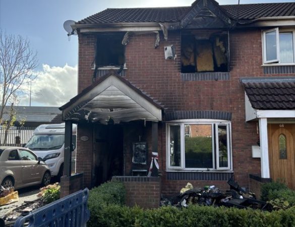 Woman taken to hospital after house fire in Monton