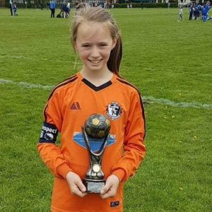 Lexi Williams with trophy at her grassroots club 