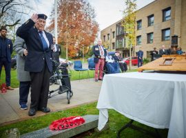 Capt Robert McMillan salutes after laying the wreath.