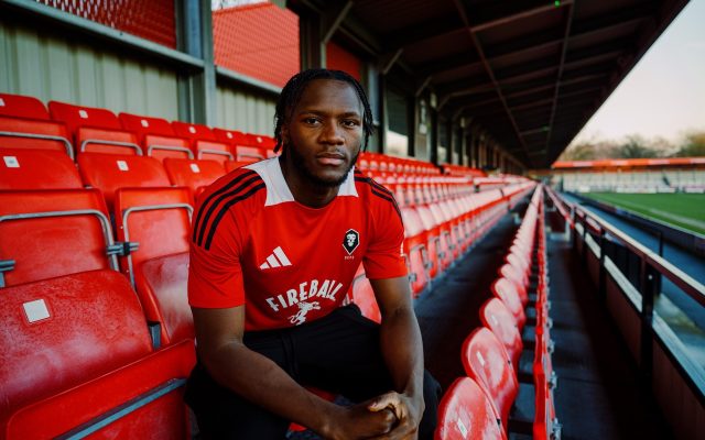 Salford City have completed the signing of versatile wing-back Rosaire Longelo from Swindon Town.