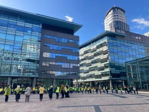 Vigil held at MediaCity with those in attendance wearing yellow