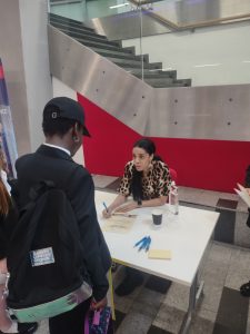 Kimberly signing students books following winning the award