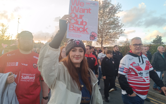 "We want our club back" - Salford Red Devils fan holds sign at the 1873 protest.