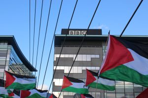 Palestinian flags underneath the BBC headquarters in Media City